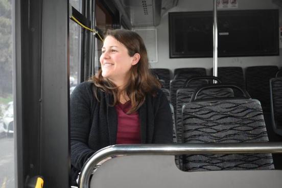 Libby Payan sitting in a bus looking out the window