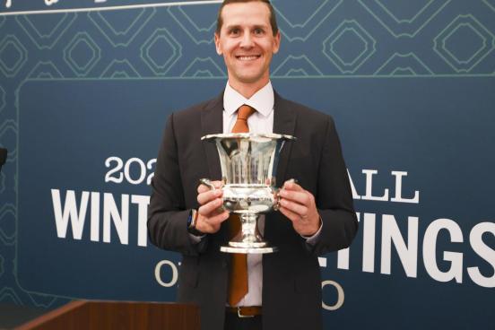 Matt Chisholm holding award 