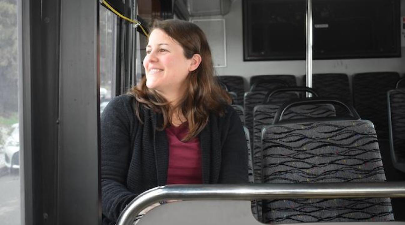 Libby Payan sitting in a bus looking out the window