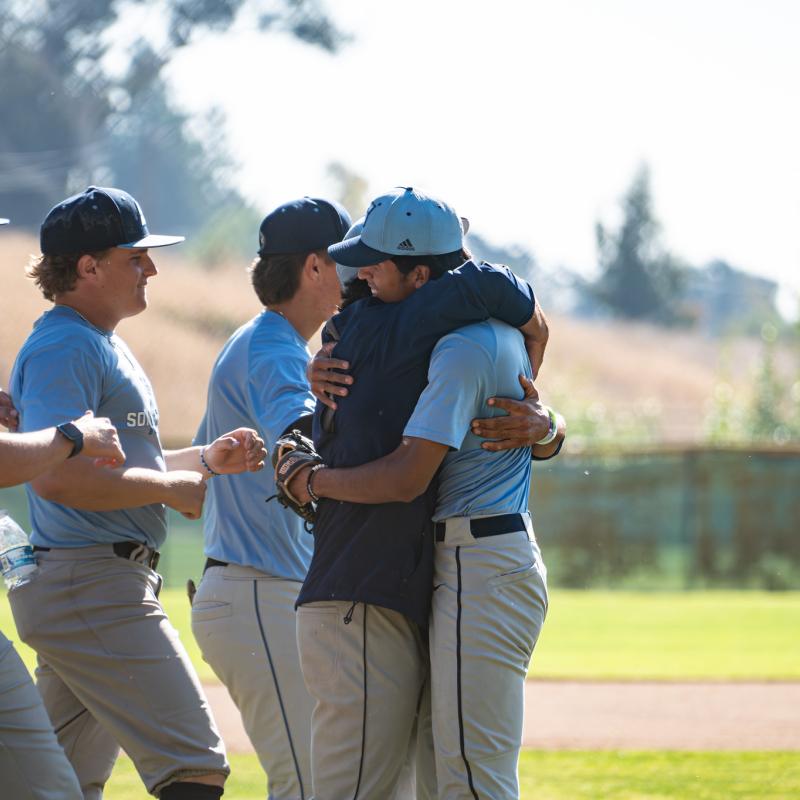 Two student hugging