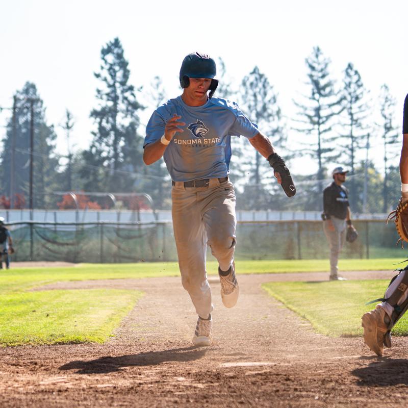 Student running to a base