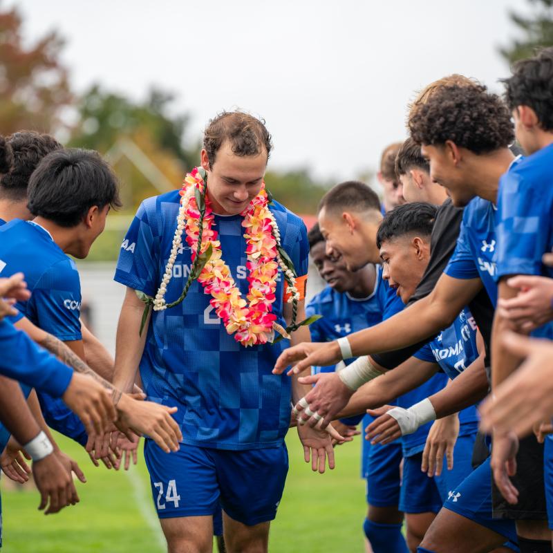Student high fiving team mates