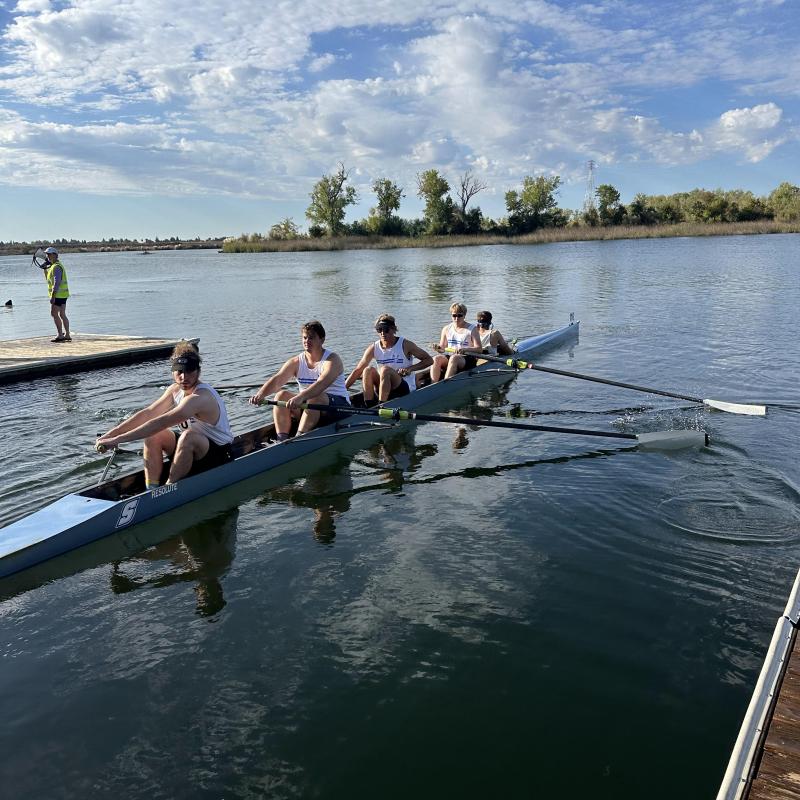 Students rowing in a boat