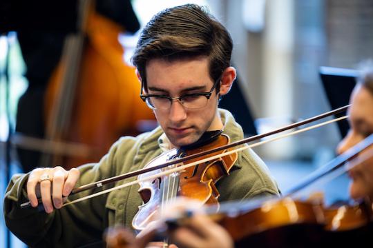 Student playing instrument