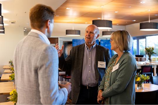 Donors and staff talking