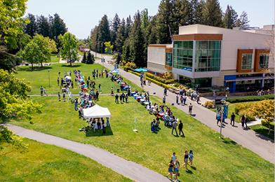 Aerial shot of a campus event with groups tabling