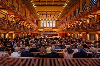 Green Music Center Weill hall show with guests sitting in chairs throughout the building