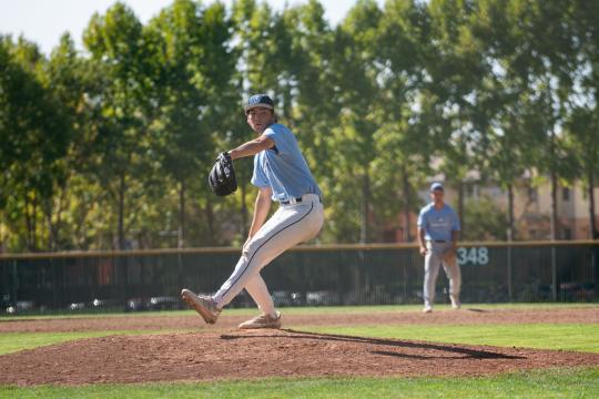 Student throwing a baseball