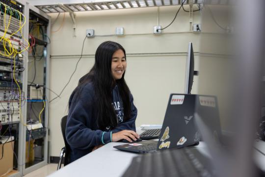Engineering student working on 2 laptops