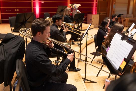 Music student playing the trombone.