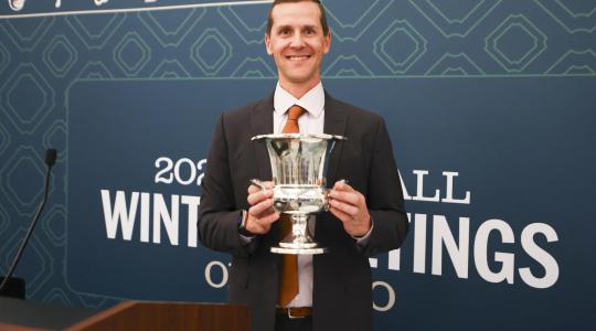 Matt Chisholm holding award 