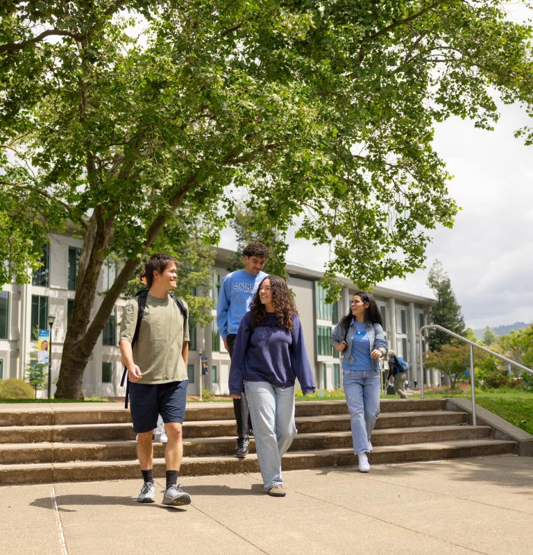 Students walking by library