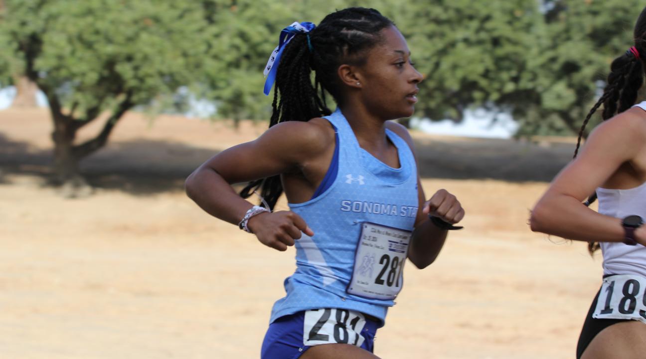 An SSU student running on the Women's Cross Country team