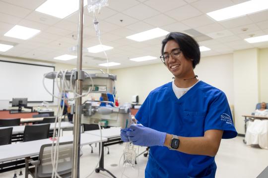 Nursing student practicing skills